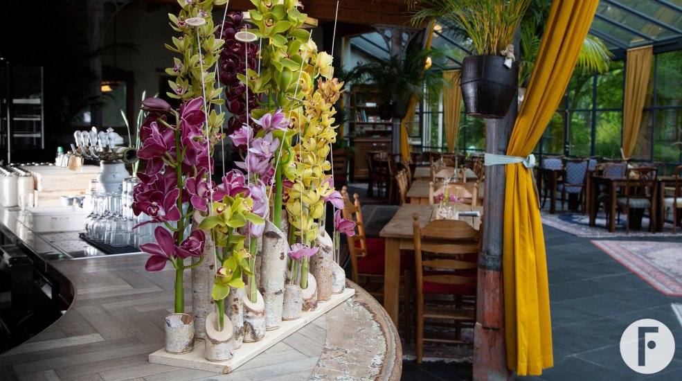 Flower arrangement for the bar with cut Cymbidium