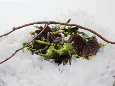 Funeral design with white paper and Anthurium - close up