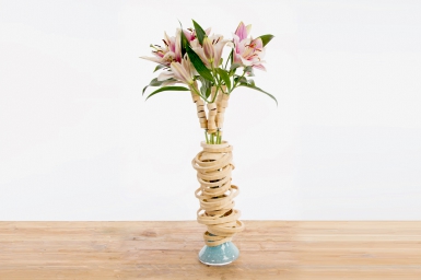 Vase design with lilies and bamboo rings