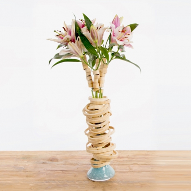 Vase design with lilies and bamboo rings